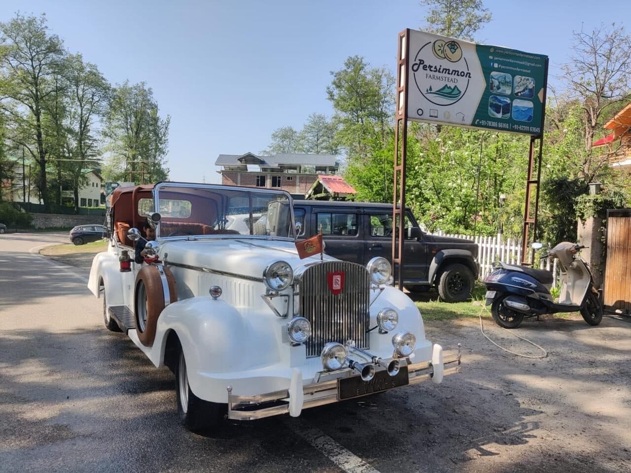 A vintage white car at the entrance